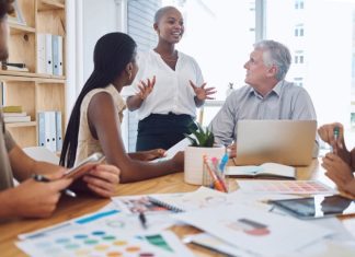 Black woman sharing ideas to employees