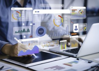 An analyst uses a computer and dashboard for data business analysis and Data Management System with KPI and metrics connected to the database for technology finance, operations, sales, marketing