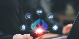 Navigating The World Of Personal Finance Apps: Simplifi And Its Competitors smartphone and a laptop computer with cloud computing diagram show on hand