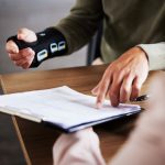 What Is A Personal Injury? How Is It Different From A Bodily Injury? Injury, compensation and man hands with insurance documents, legal contract and paperwork. Disability, accident and people in lawyer or attorney meeting for advice, agreement or policy report closeup