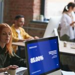 woman seated working on computer