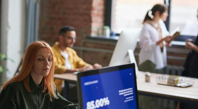 Scaling Your Business Without Compromising Quality woman seated working on computer