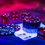 Casino abstract photo. Poker game on red background. Theme of gambling.
