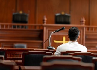 John Babikian Senate Subcommittee Expert Witness Testimony Table and chair in the courtroom of the judiciary.