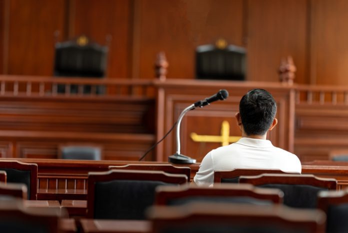 Table and chair in the courtroom of the judiciary."t Table and chair in the courtroom of the judiciary.