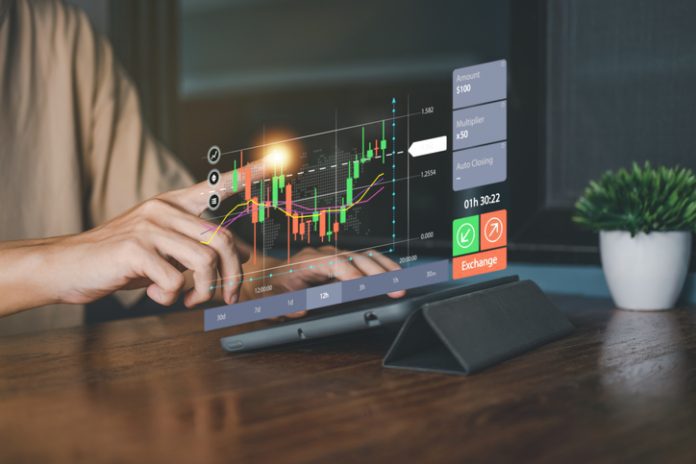 Success business concept. Businessman hand touch hologram of Stock chart or Cryptocurrency chart with tablet. Statistics graph and char growing graph of Planning and strategy concept. statistic and graph for trading
