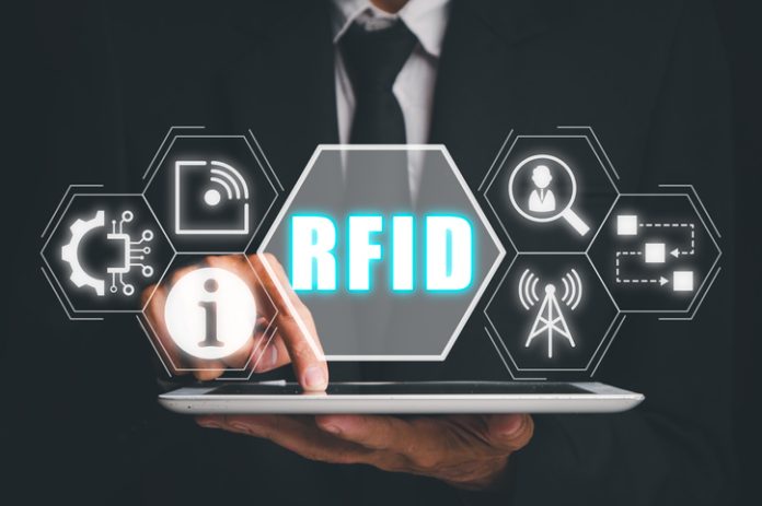 RFID, Radio frequency identification concept, Person using digital tablet and hand touching RFID icon on virtual screen. RFID Tracking