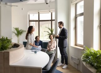 Confident boss lead morning briefing for corporate staff members