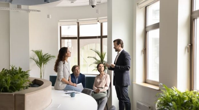 Confident boss lead morning briefing for corporate staff members