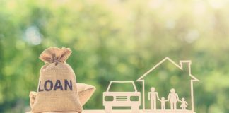 Understanding the Difference Between Term Loans & Unsecured Business loans Family financial management, mortgage and payday loan or cash advance concept : Loan bags, family in a house on balance scale, depicts short term borrowing, high interest rate based on credit profile