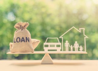 Family financial management, mortgage and payday loan or cash advance concept : Loan bags, family in a house on balance scale, depicts short term borrowing, high interest rate based on credit profile