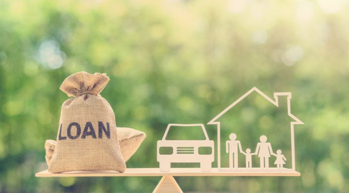 Understanding the Difference Between Term Loans & Unsecured Business loans Family financial management, mortgage and payday loan or cash advance concept : Loan bags, family in a house on balance scale, depicts short term borrowing, high interest rate based on credit profile