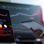 businessman using tablet on profit trading