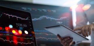 Take Profit Trader vs Apex Trader Funding: Which Prop Firm Is Best For You? businessman using tablet on profit trading