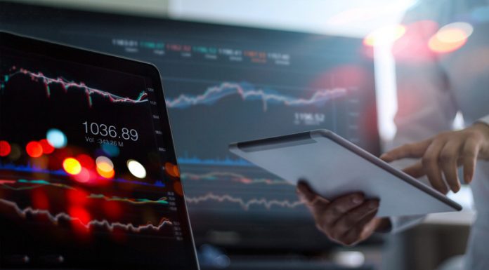 Take Profit Trader vs Apex Trader Funding: Which Prop Firm Is Best For You? businessman using tablet on profit trading