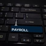 6 Payroll Software Solutions for Growing UK Businesses payroll word on keyboard