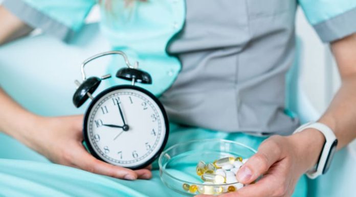 How Much Does Inspire Sleep Therapy Cost? A Comprehensive Pricing Guide Therapist holding a alarm clock and vitamins