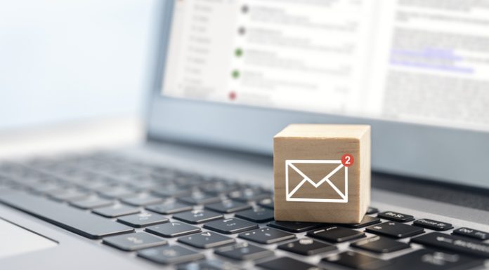 Trustworthy Transactions: The Power of Reliable Check Mailing in Brand Building email symbol on wooden block