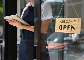 woman standing at coffee shop entrance