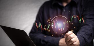 Seeking Alpha vs Zacks: Which Investment Research Platform Is Best? magnifying glass and investment