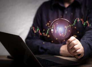 magnifying glass and investment