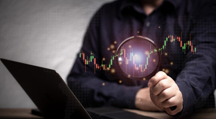 magnifying glass and investment