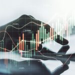 financial diagram with finger in apex trading