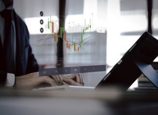 businessman holding virtual trading