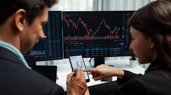 Take Profit Trader vs TopStep: Comparing These Two Prop Firms trader with trading graph on monitor