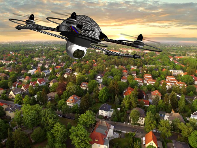 iStock-585502550 (1) drone over suburban houses