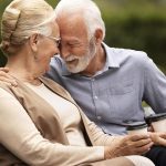 senior couple holding a cup of coffee