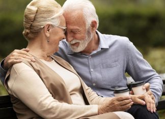 senior couple holding a cup of coffee