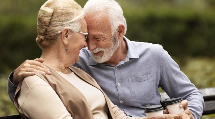 senior couple holding a cup of coffee