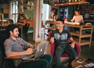 Creating a High-Performance Culture: Is Your HR Leading the Way? Gentlemen having a conversation while sitting on chairs