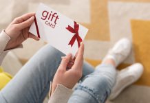 woman holding a gift card