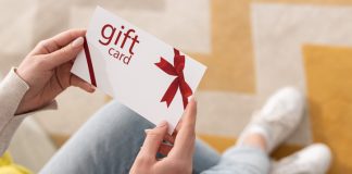 woman holding a gift card