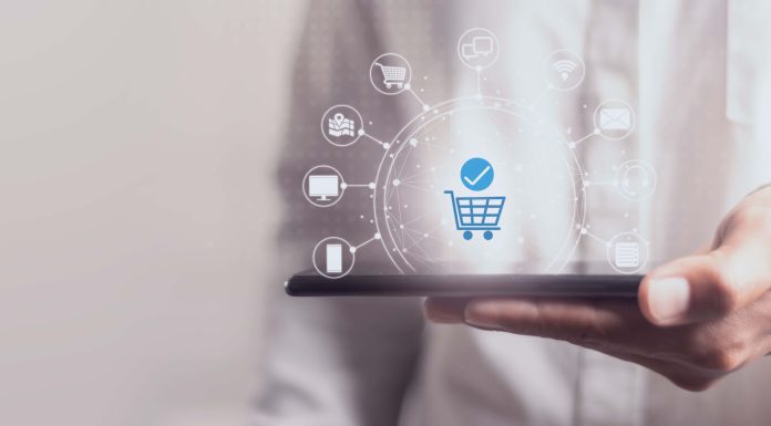 Mastering Omnichannel Fulfillment: Leveraging Software Solutions for Retail Success Person holding a digital tablet with technology icon media