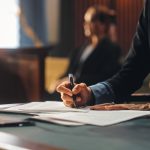 Navigating Legal Waters: A Comprehensive Guide to Hiring a Lawyer for Work-Related Injuries Court of Justice and Law Trial: Female Public Defender Writes Down Arguments for Defence Strategy. Successful Attorney Lawyer Fight for Freedom of Her Client with Supporting Evidence. Close Up.