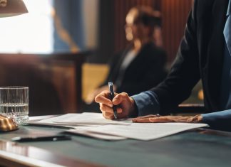 Navigating Legal Waters: A Comprehensive Guide to Hiring a Lawyer for Work-Related Injuries Court of Justice and Law Trial: Female Public Defender Writes Down Arguments for Defence Strategy. Successful Attorney Lawyer Fight for Freedom of Her Client with Supporting Evidence. Close Up.