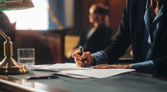 Navigating Legal Waters: A Comprehensive Guide to Hiring a Lawyer for Work-Related Injuries Court of Justice and Law Trial: Female Public Defender Writes Down Arguments for Defence Strategy. Successful Attorney Lawyer Fight for Freedom of Her Client with Supporting Evidence. Close Up.