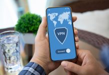 Streamlined VPN Connection: Quick Connect Male holding phone with VPN on screen