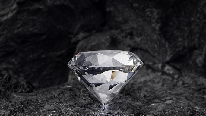 Need to Know Before Buying a Lab-Grown Diamond Engagement Ring diamond on black coal background