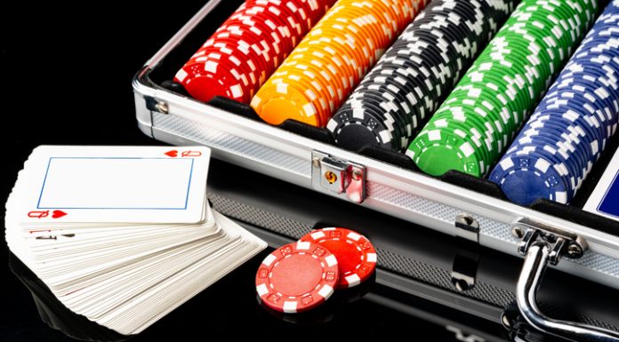 The Winds of Change Are Blowing Through Gambling Laws Around the World Poker game case on black background close up