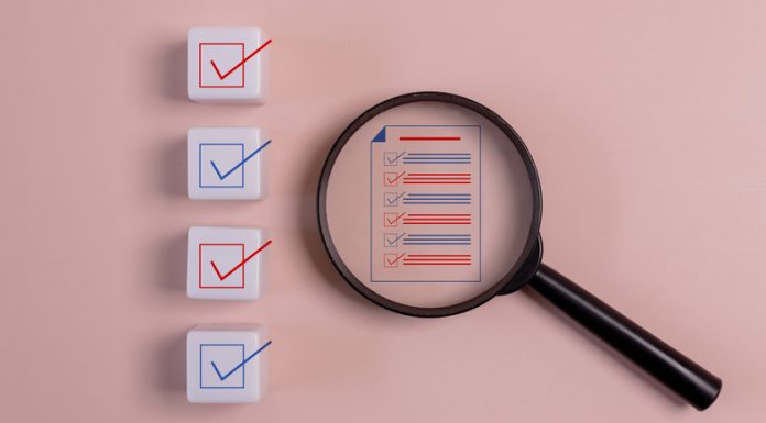The Insider’s Guide to Understanding Background Check Reports: What You Need to Know Magnifying glass with a list of check boxes