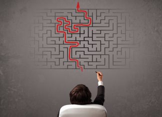 businessman looking at a maze