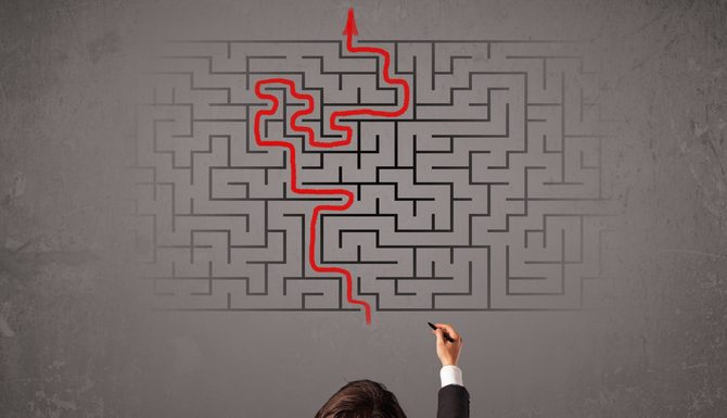 The Myth of Fixability: Why Do We Think there is a Silver Bullet to Complex Business Problems? businessman looking at a maze