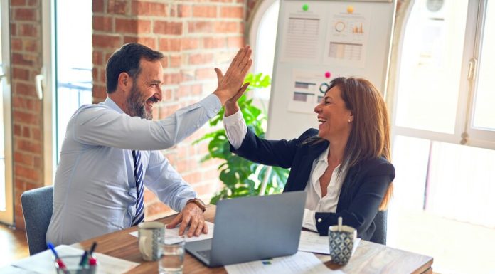 Future-Proofing Leadership: Adapting Management Styles for Tomorrow’s Challenges Two business workers happy and confident