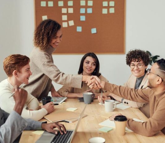 Colleagues Shaking each other's Hands. How a leader shows Emotional Intelligence towards colleague