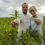 couple holding CBD leaf