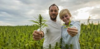 couple holding CBD leaf